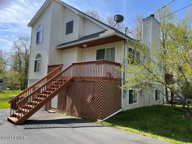 184 Skyview Road Dingmans Ferry, PA 18328 - Photo 2 of 26 a front view of a house with a garden