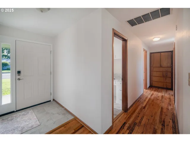 a bathroom with a sink and vanity