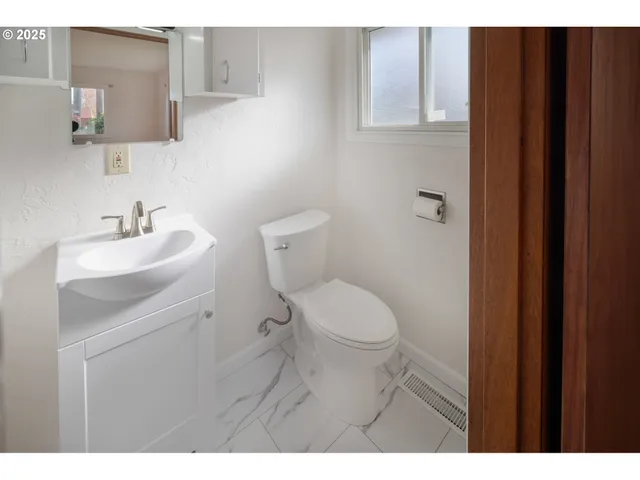 a bathroom with a sink and mirror
