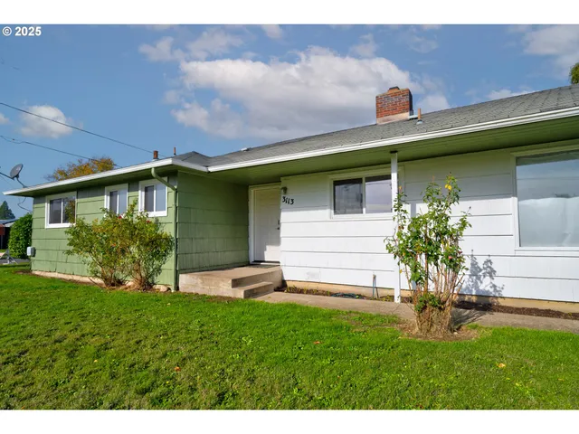 a house with a tree in front of it