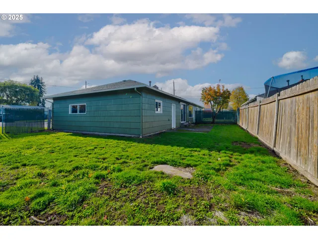 a backyard of a house with lots of green space