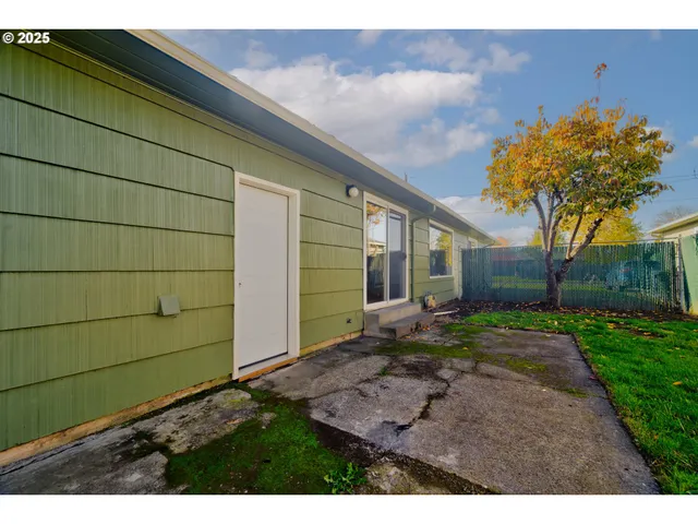 a backyard of a house with lots of green space