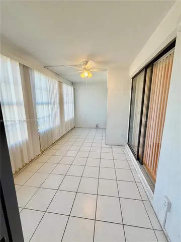 a view of an empty room with windows