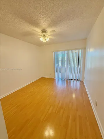 a view of livingroom with hardwood floor and a ceiling fan
