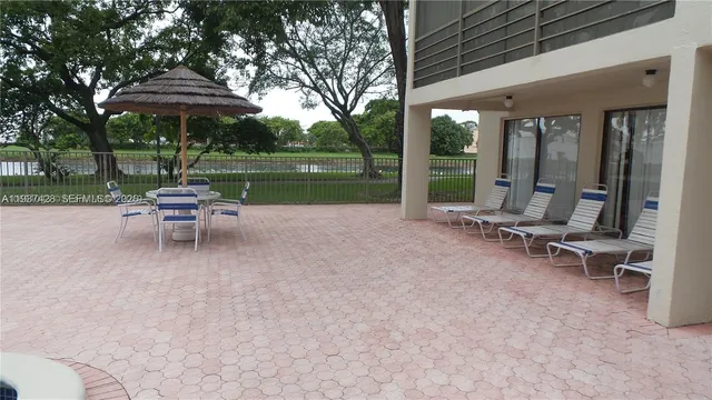 a view of a swimming pool with a patio