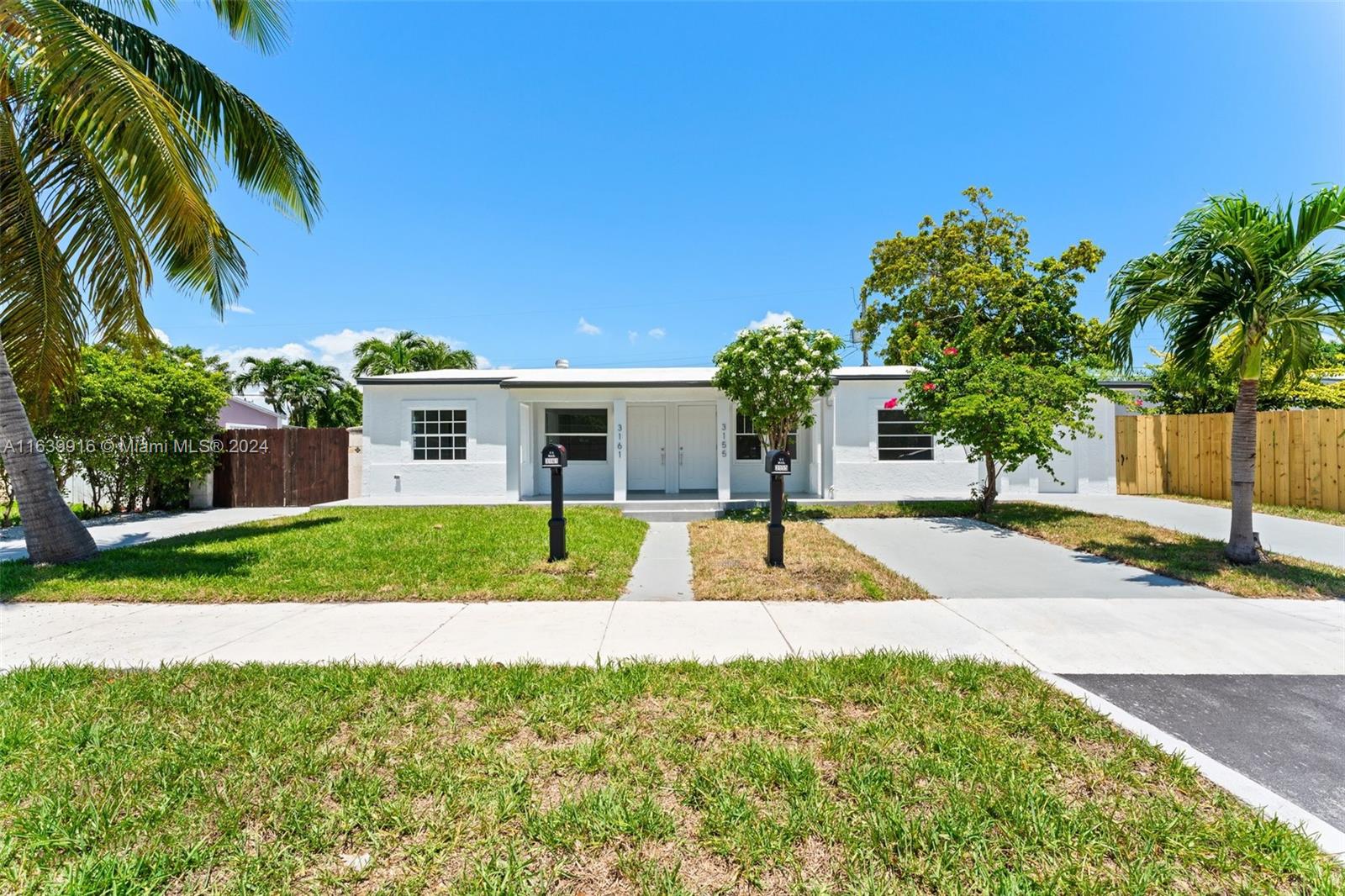 3155 Southwest 27th Lane, Unit 1 Miami, FL 33133 - Photo 1 of 18 a house with swimming pool in front of it