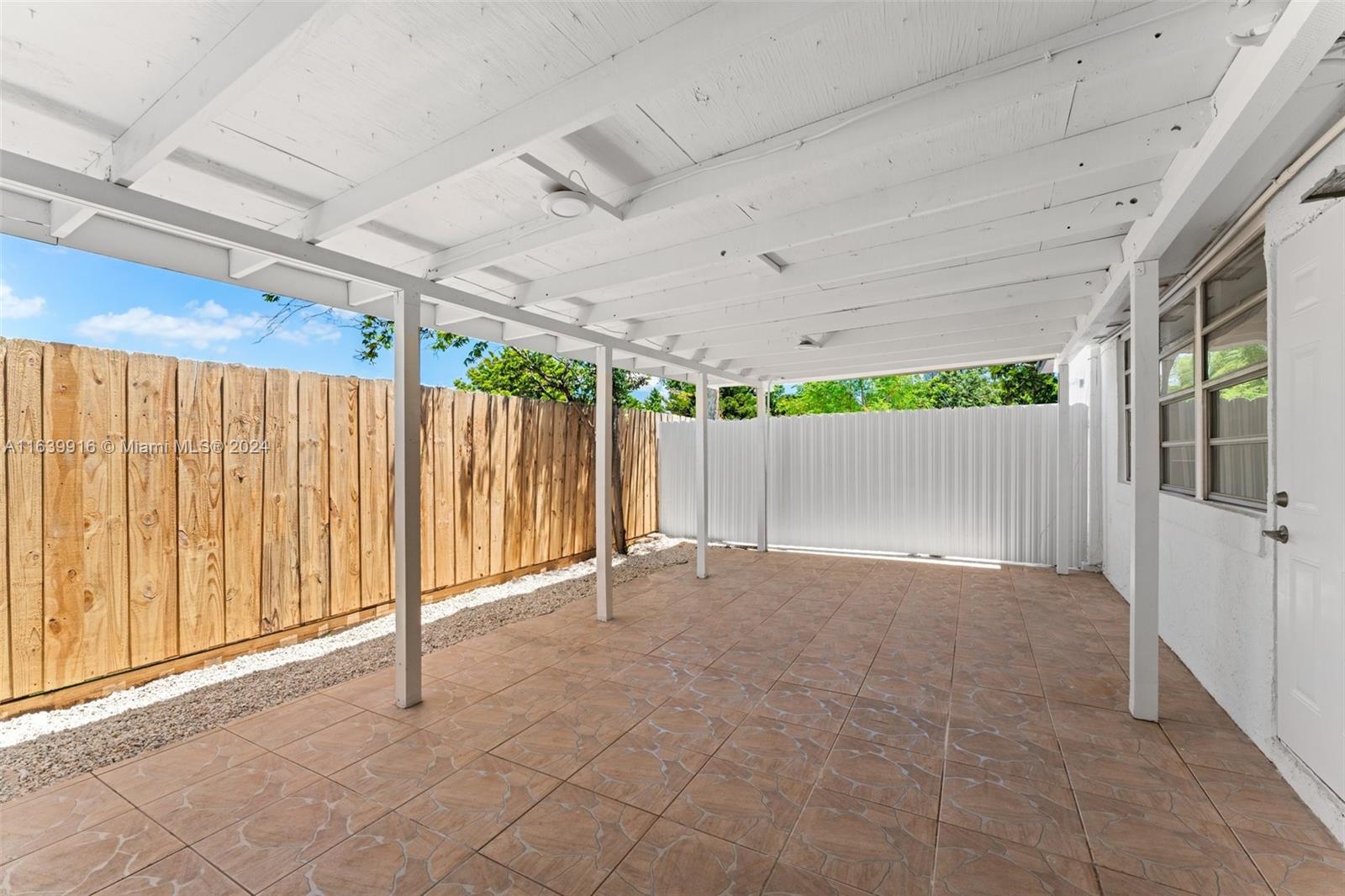 3155 Southwest 27th Lane, Unit 1 Miami, FL 33133 - Photo 17 of 18 a view of backyard and porch
