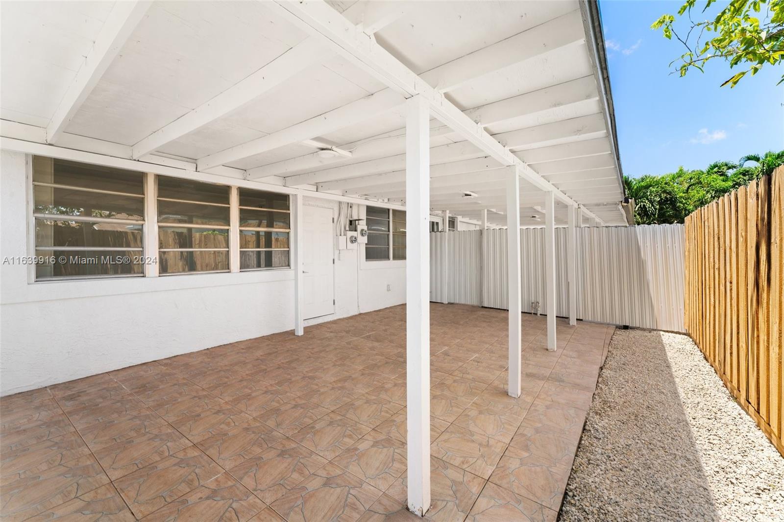 3155 Southwest 27th Lane, Unit 1 Miami, FL 33133 - Photo 18 of 18 a view of an empty room with a window