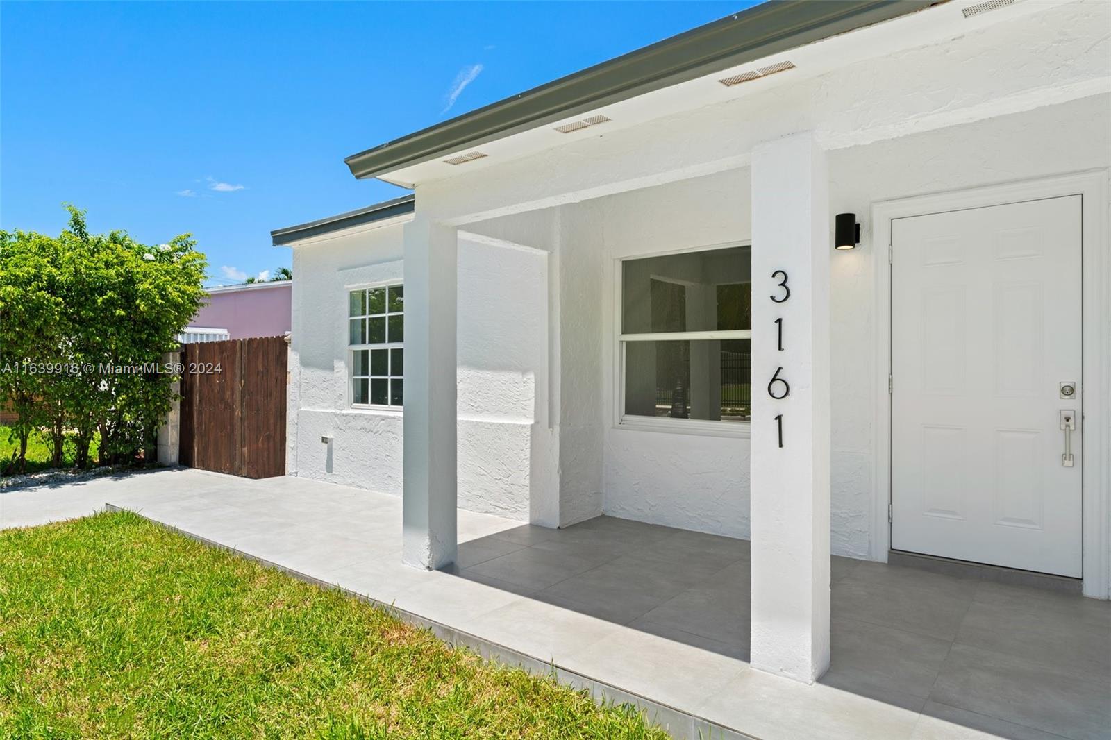 3155 Southwest 27th Lane, Unit 1 Miami, FL 33133 - Photo 3 of 18 a view of house with backyard and outdoor space