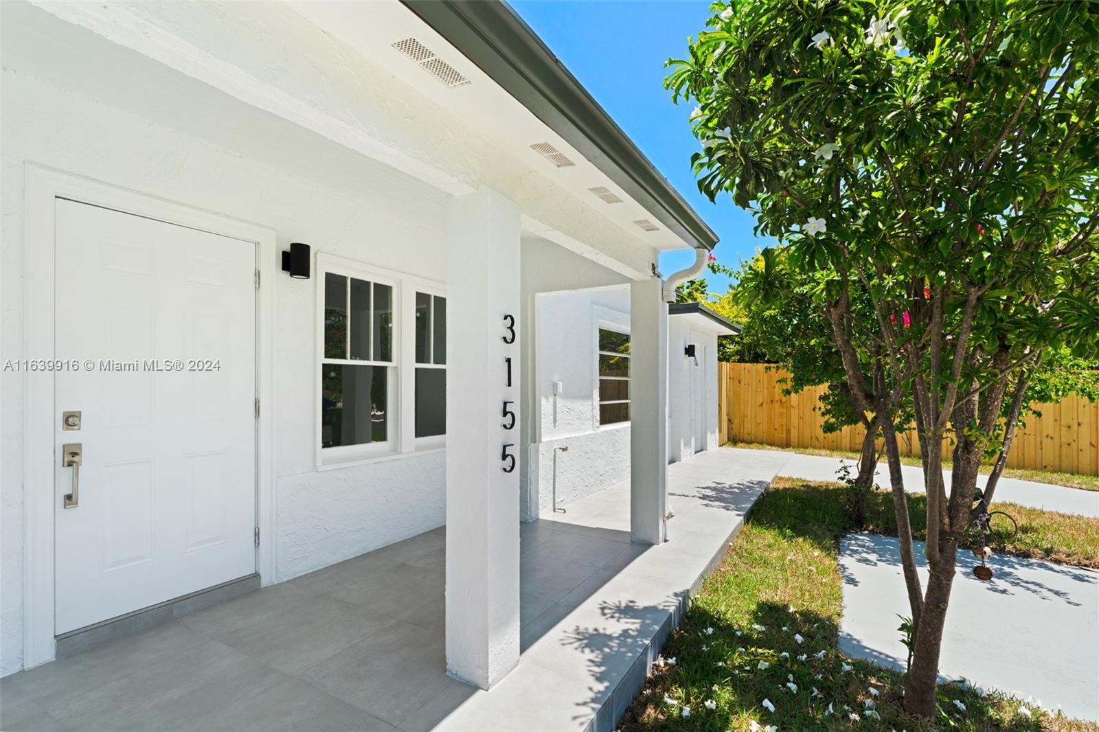 3155 Southwest 27th Lane, Unit 1 Miami, FL 33133 - Photo 4 of 18 a view of backyard of the house