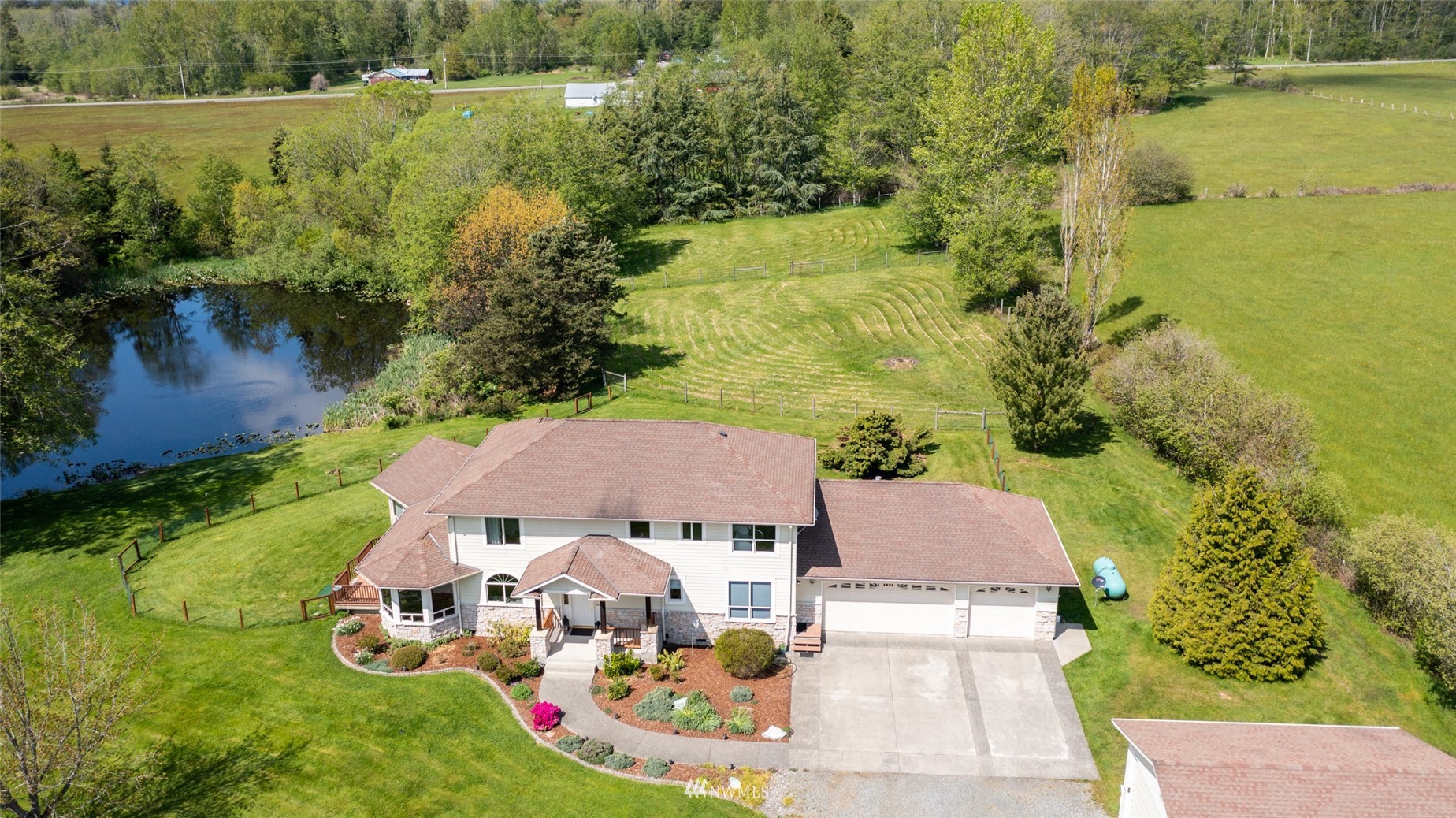 6187 Swanson Road Bow, WA 98232 - Photo 1 of 40 an aerial view of a house with outdoor space lake residential house and green space