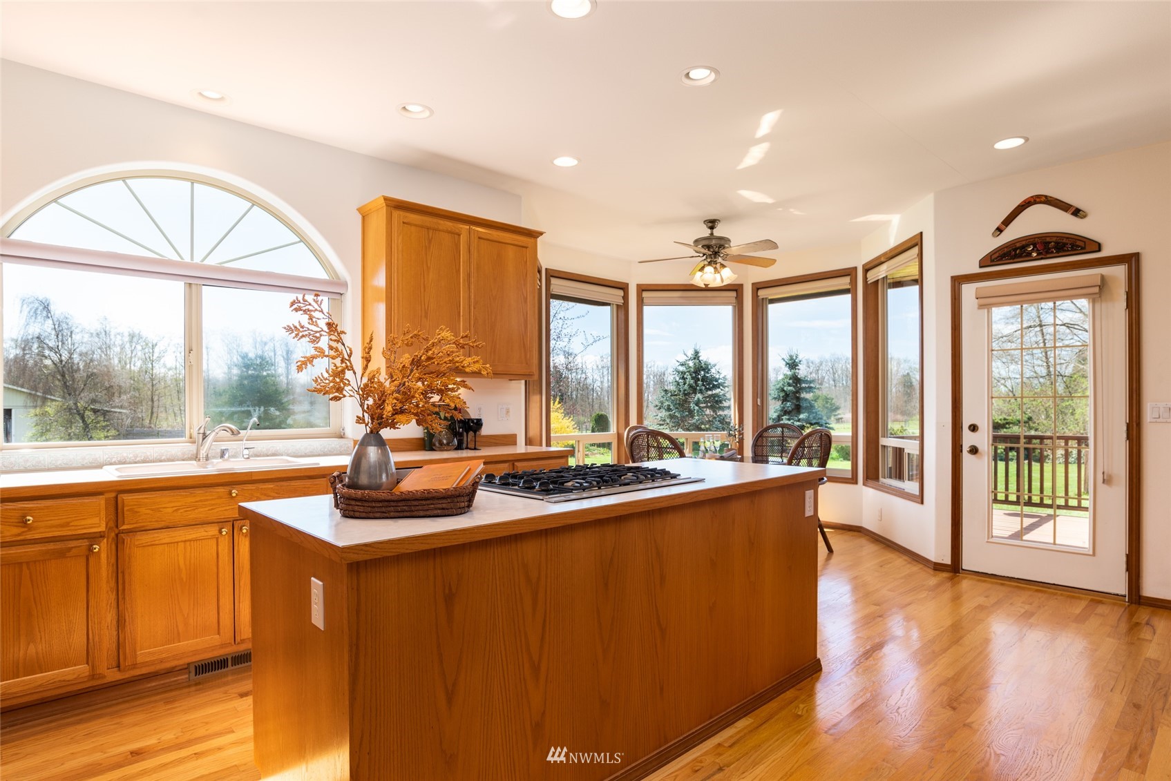 6187 Swanson Road Bow, WA 98232 - Photo 13 of 40 a view of a living room and kitchen with a large window
