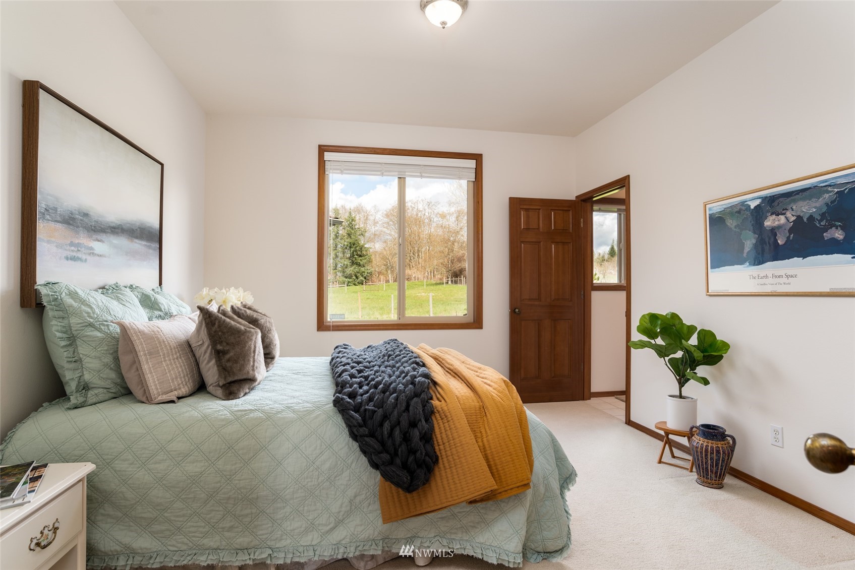 6187 Swanson Road Bow, WA 98232 - Photo 15 of 40 a bedroom with a bed and a window