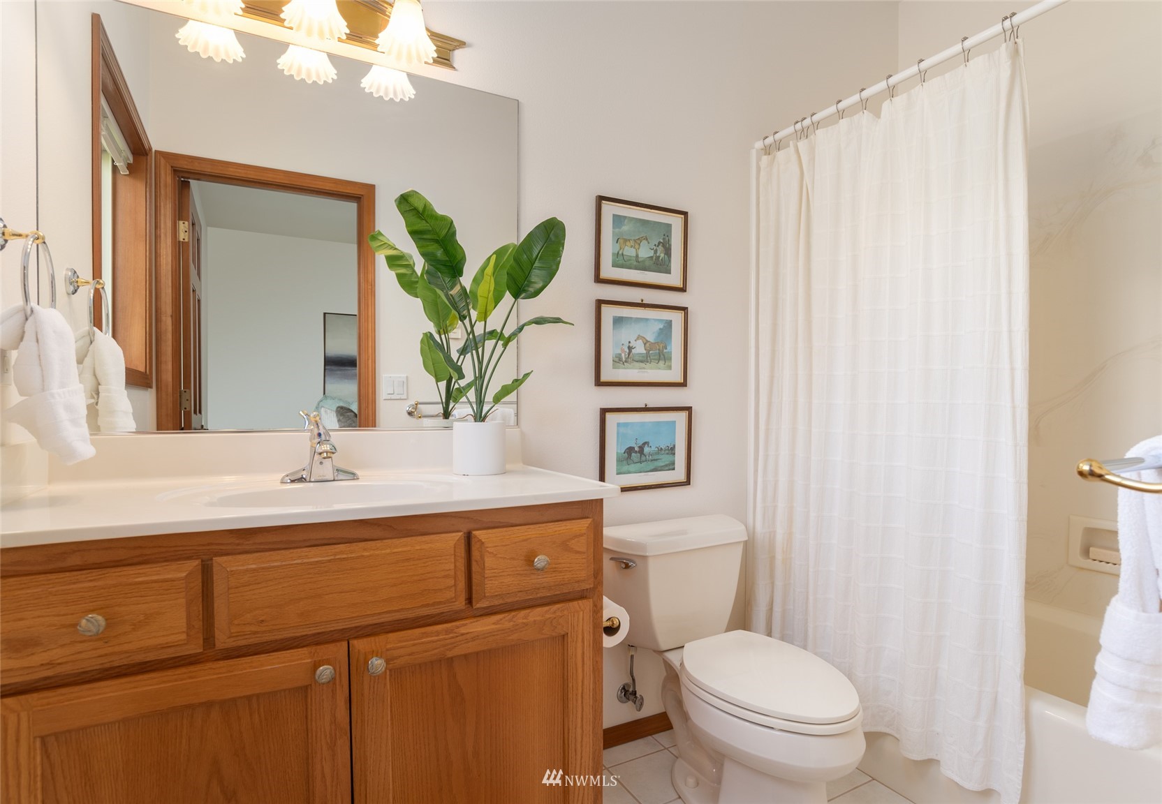 6187 Swanson Road Bow, WA 98232 - Photo 16 of 40 a bathroom with a sink a toilet a window and shower