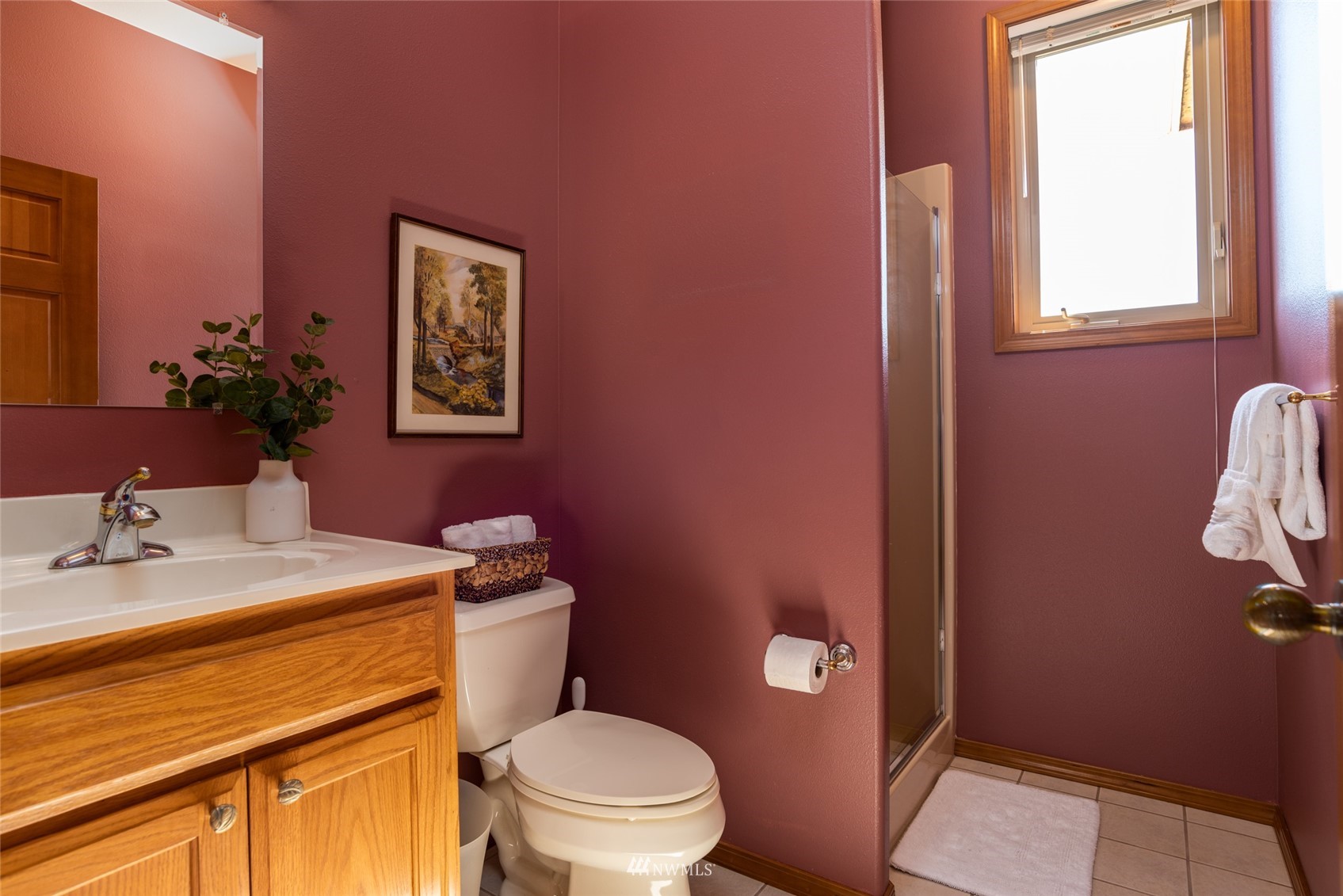 6187 Swanson Road Bow, WA 98232 - Photo 17 of 40 a bathroom with a sink mirror vanity and toilet