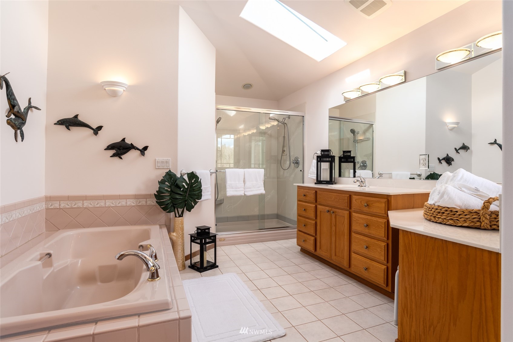 6187 Swanson Road Bow, WA 98232 - Photo 21 of 40 a bathroom with a granite countertop sink a large mirror and shower