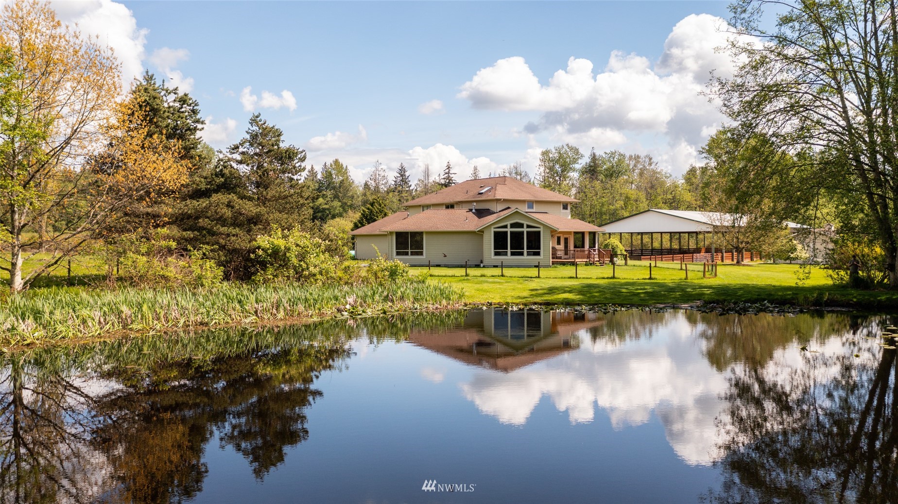 6187 Swanson Road Bow, WA 98232 - Photo 25 of 40 a view of a lake with houses in the background