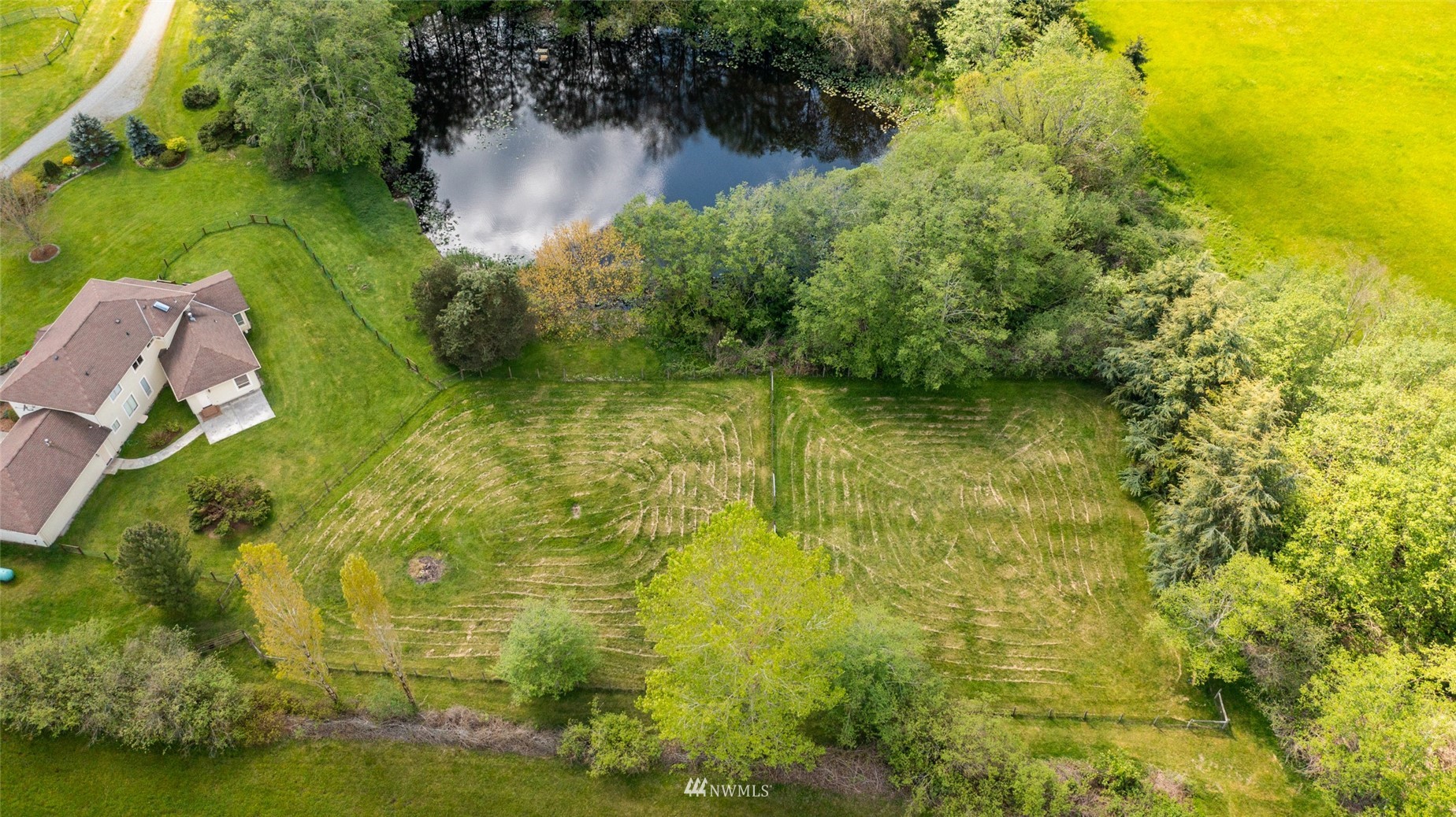 6187 Swanson Road Bow, WA 98232 - Photo 38 of 40 a view of a lake with a yard