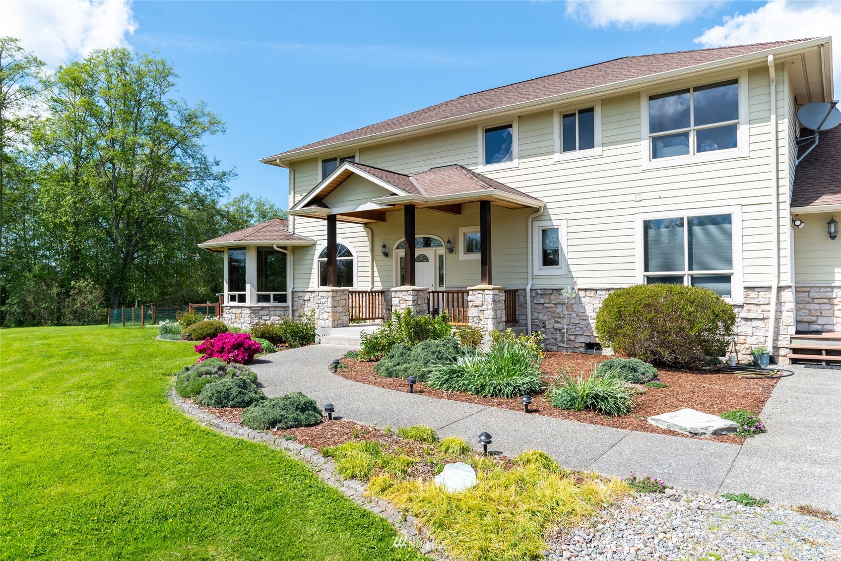 6187 Swanson Road Bow, WA 98232 - Photo 4 of 40 a front view of a house with a yard