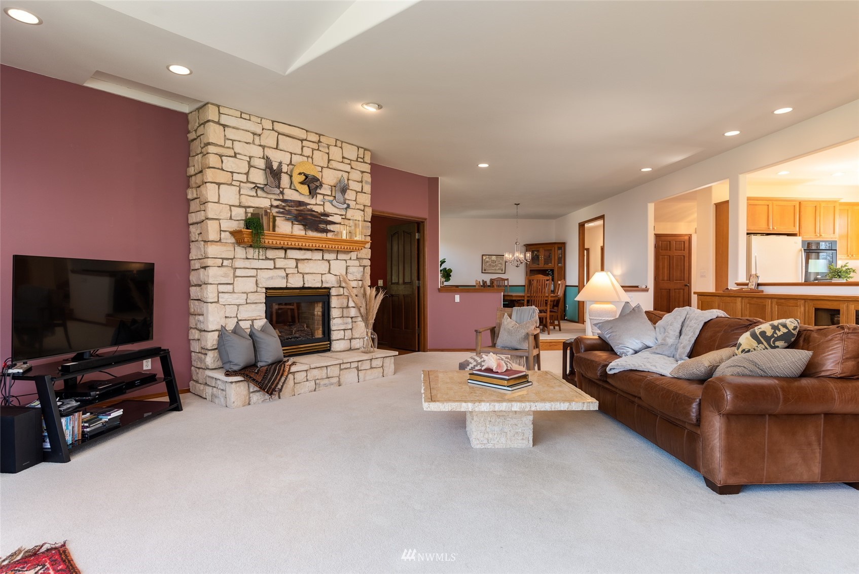 6187 Swanson Road Bow, WA 98232 - Photo 9 of 40 a living room with furniture a flat screen tv and a fireplace
