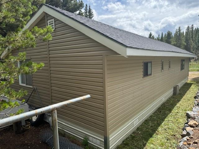 325 Aspen Road Idaho Springs, CO 80452 - Photo 2 of 12 a view of a small house with a yard