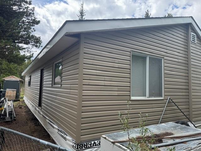 325 Aspen Road Idaho Springs, CO 80452 - Photo 4 of 12 a view of a back side of the house