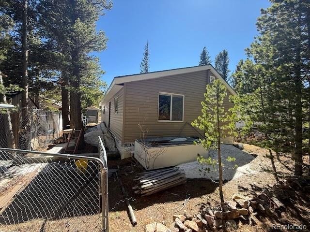 325 Aspen Road Idaho Springs, CO 80452 - Photo 5 of 12 a view of a roof deck with couches and wooden floor
