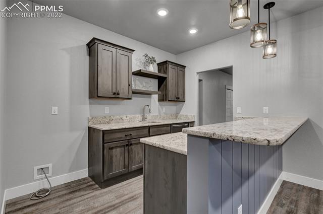 1954 Bashley Road Monument, CO 80132 - Photo 38 of 50 Wet Bar with a place for a full size fridge
