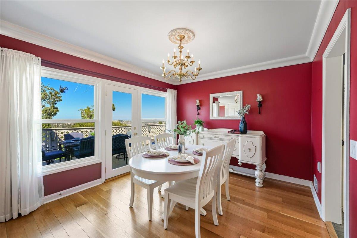 330 41st Avenue San Mateo, CA 94403 - Photo 13 of 38 a view of a dining room with furniture wooden floor and a chandelier