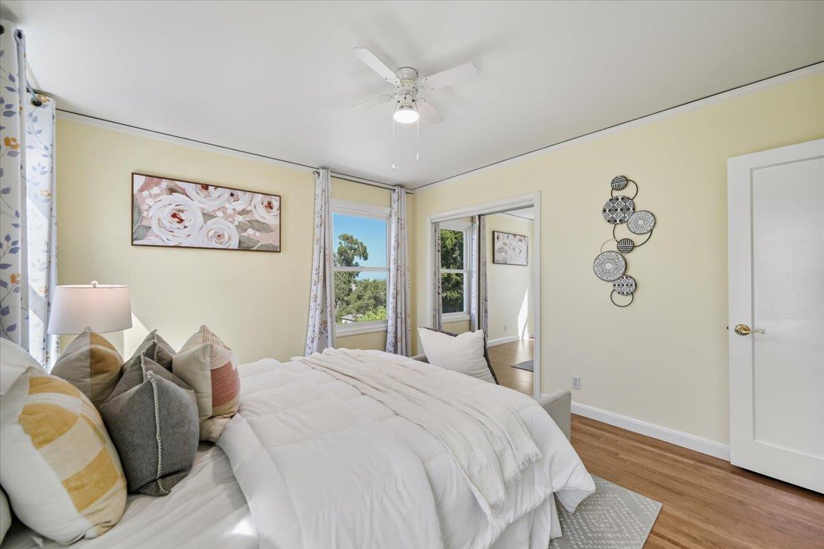 330 41st Avenue San Mateo, CA 94403 - Photo 26 of 38 a bedroom with a bed and wooden floor