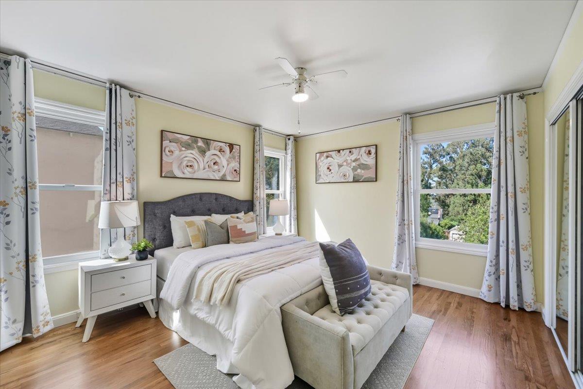 330 41st Avenue San Mateo, CA 94403 - Photo 28 of 38 a bedroom with a large bed and a couch