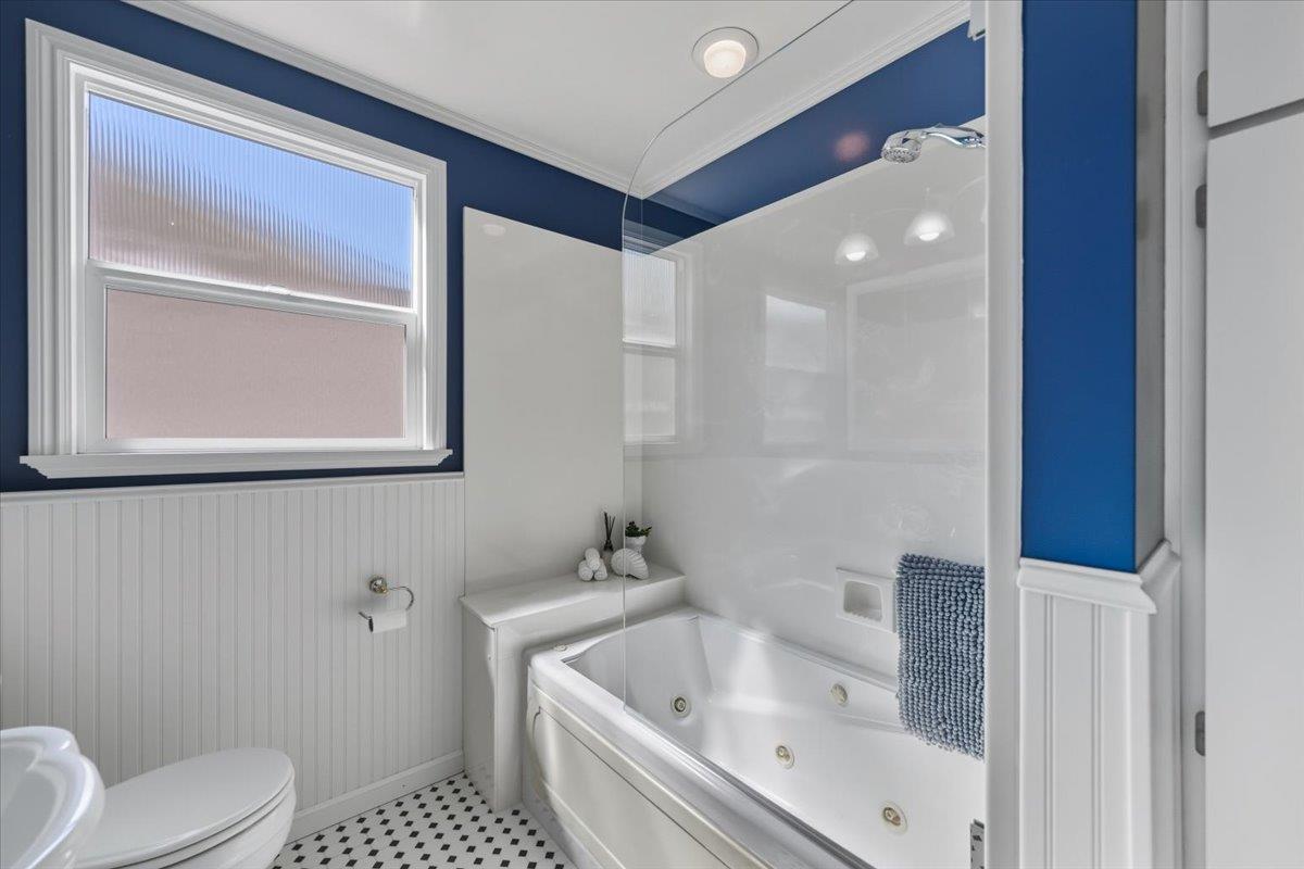330 41st Avenue San Mateo, CA 94403 - Photo 31 of 38 a bathroom with a sink a toilet and shower
