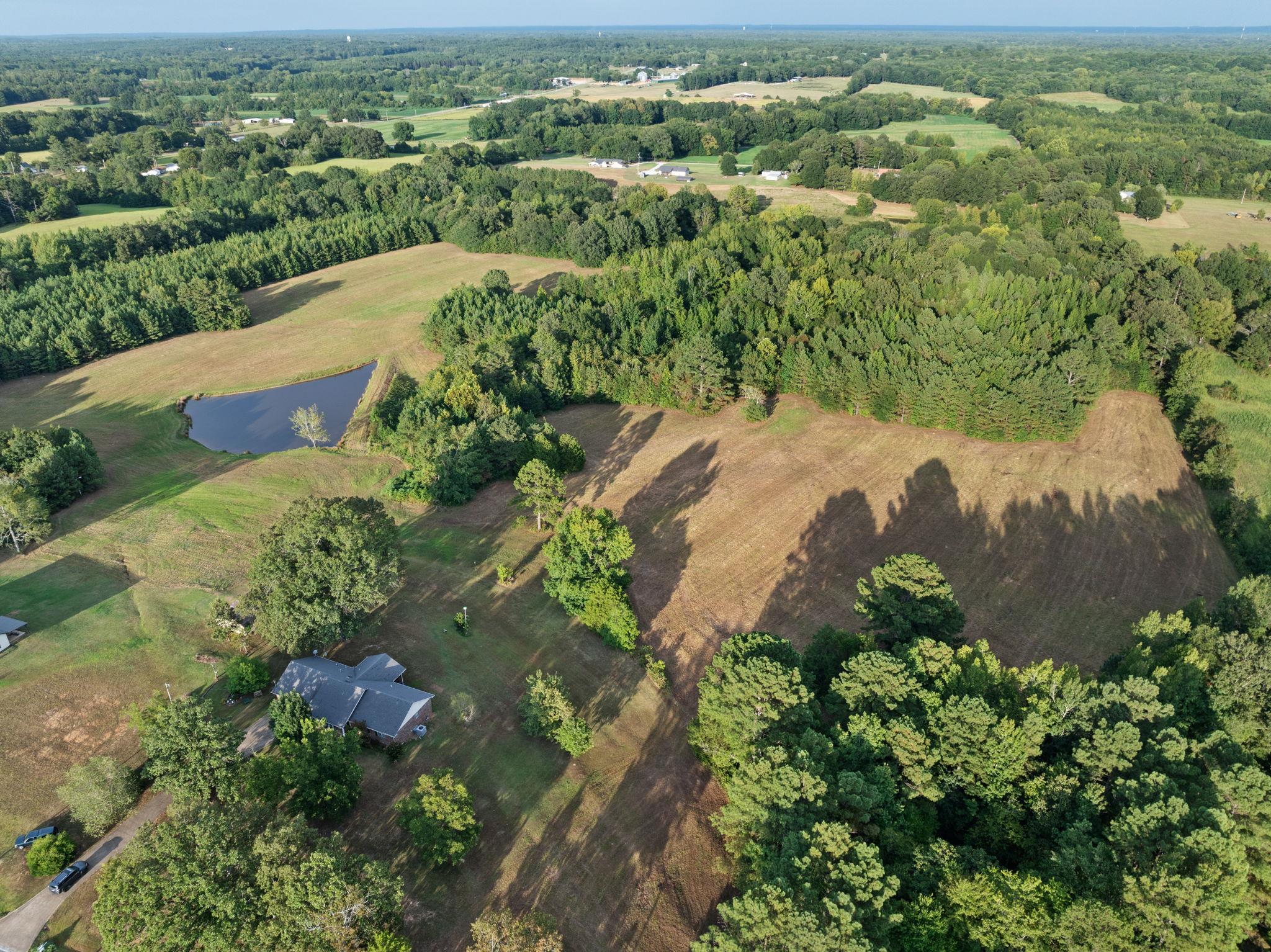 116 County Road 713 Corinth, MS 38834 - Photo 24 of 40 an aerial view of a houses with a yard