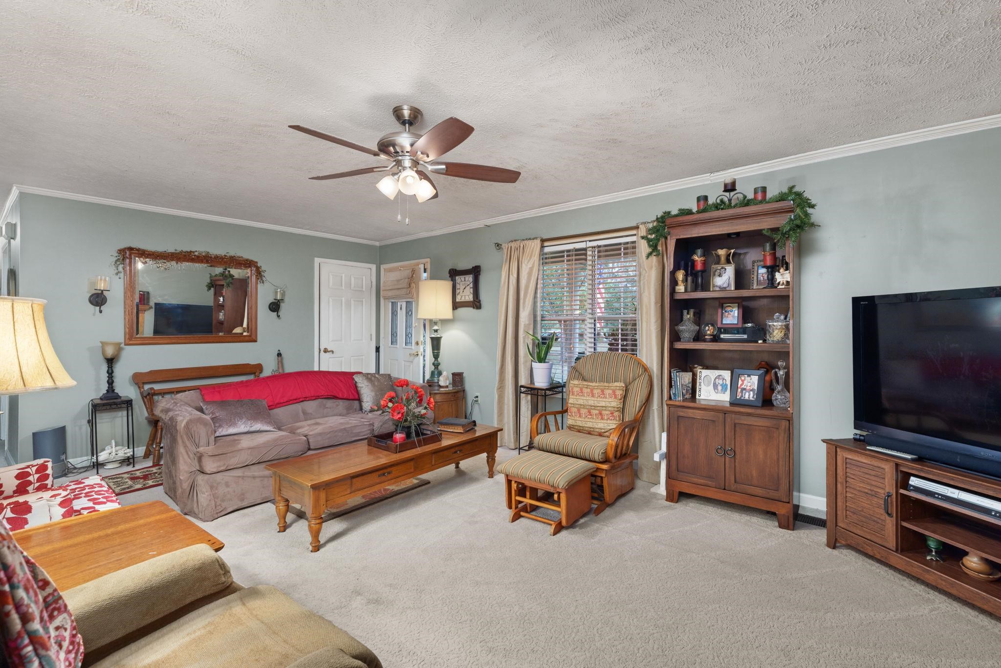 116 County Road 713 Corinth, MS 38834 - Photo 28 of 40 a living room with furniture and a flat screen tv