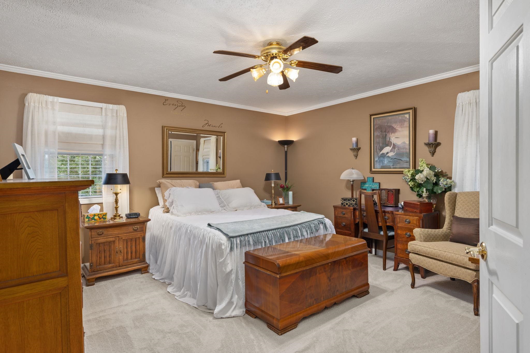 116 County Road 713 Corinth, MS 38834 - Photo 33 of 40 Bedroom with light carpet, a textured ceiling, ceiling fan, and crown molding