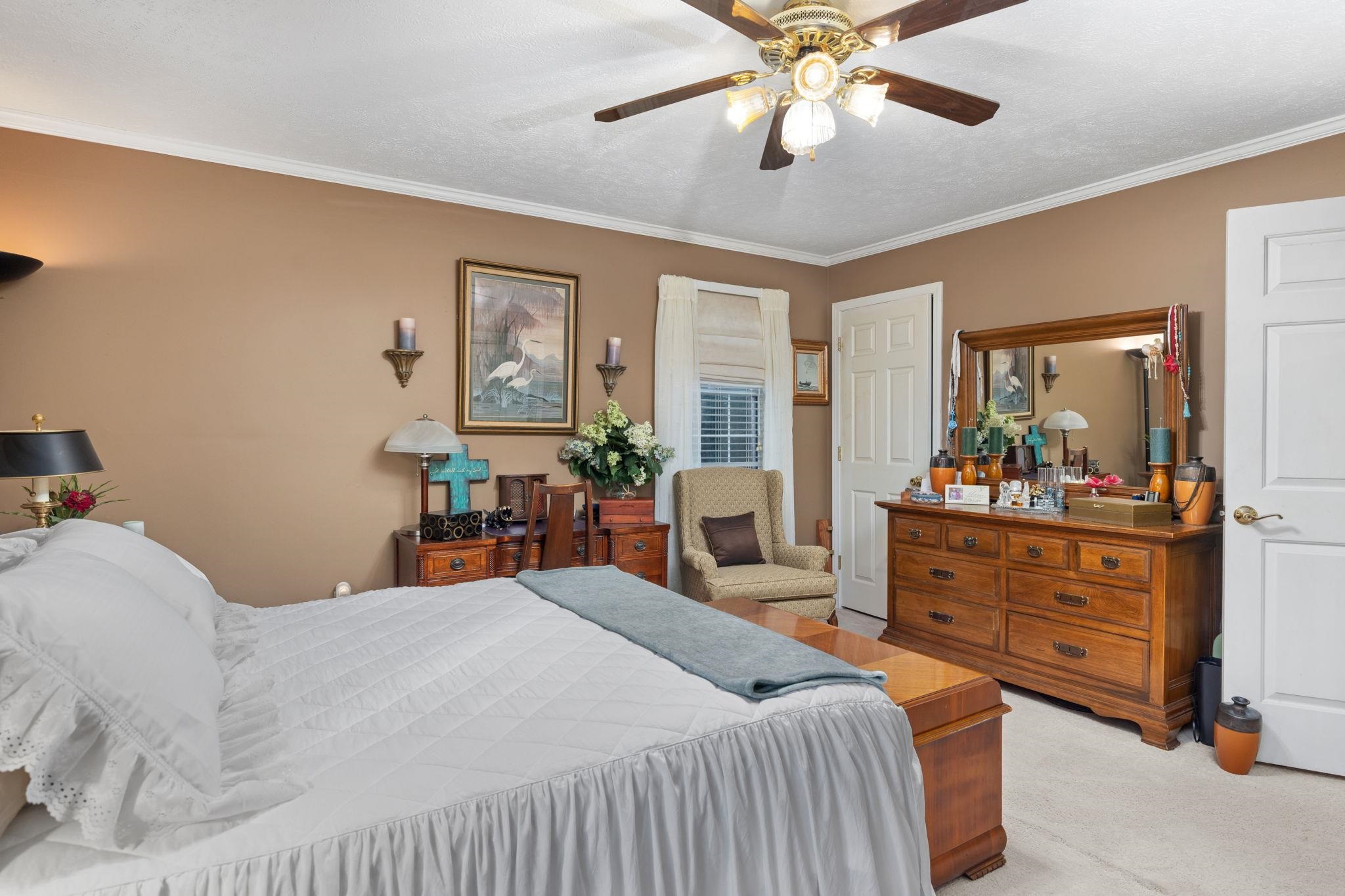 116 County Road 713 Corinth, MS 38834 - Photo 34 of 40 a bedroom with a bed and ceiling fan