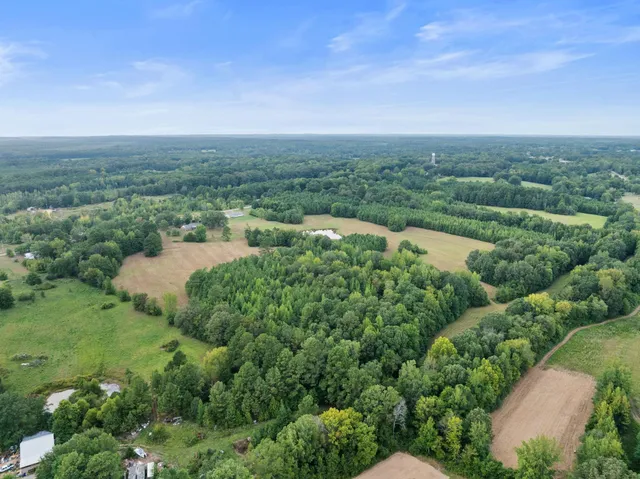 a view of a lake with green space