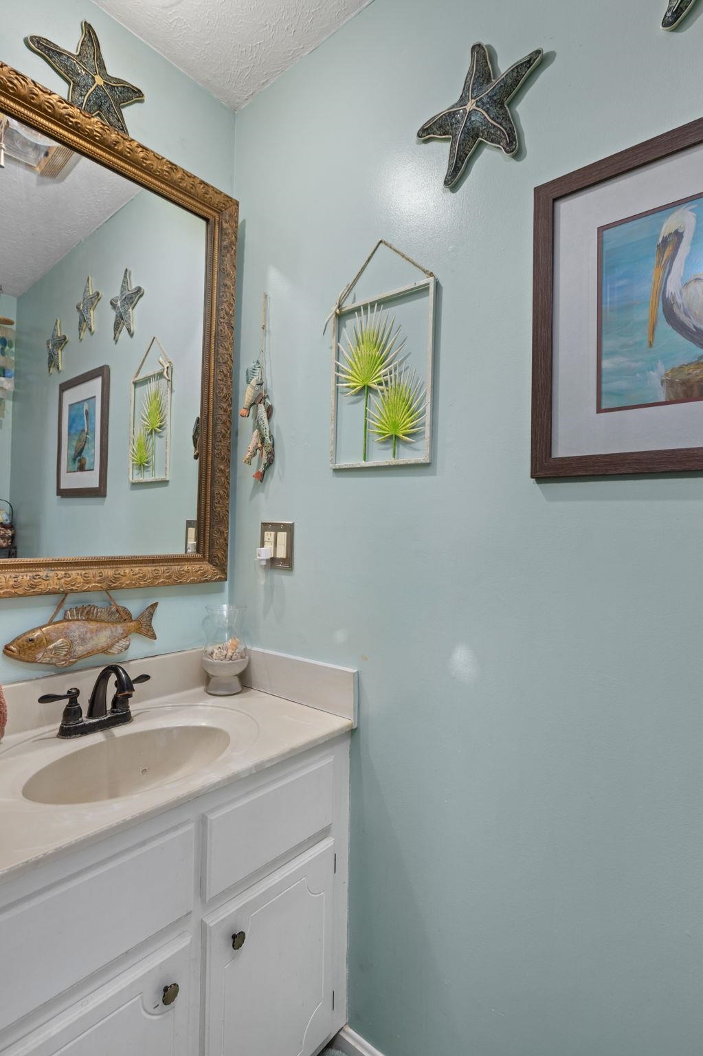 116 County Road 713 Corinth, MS 38834 - Photo 40 of 40 a bathroom with a sink and a mirror