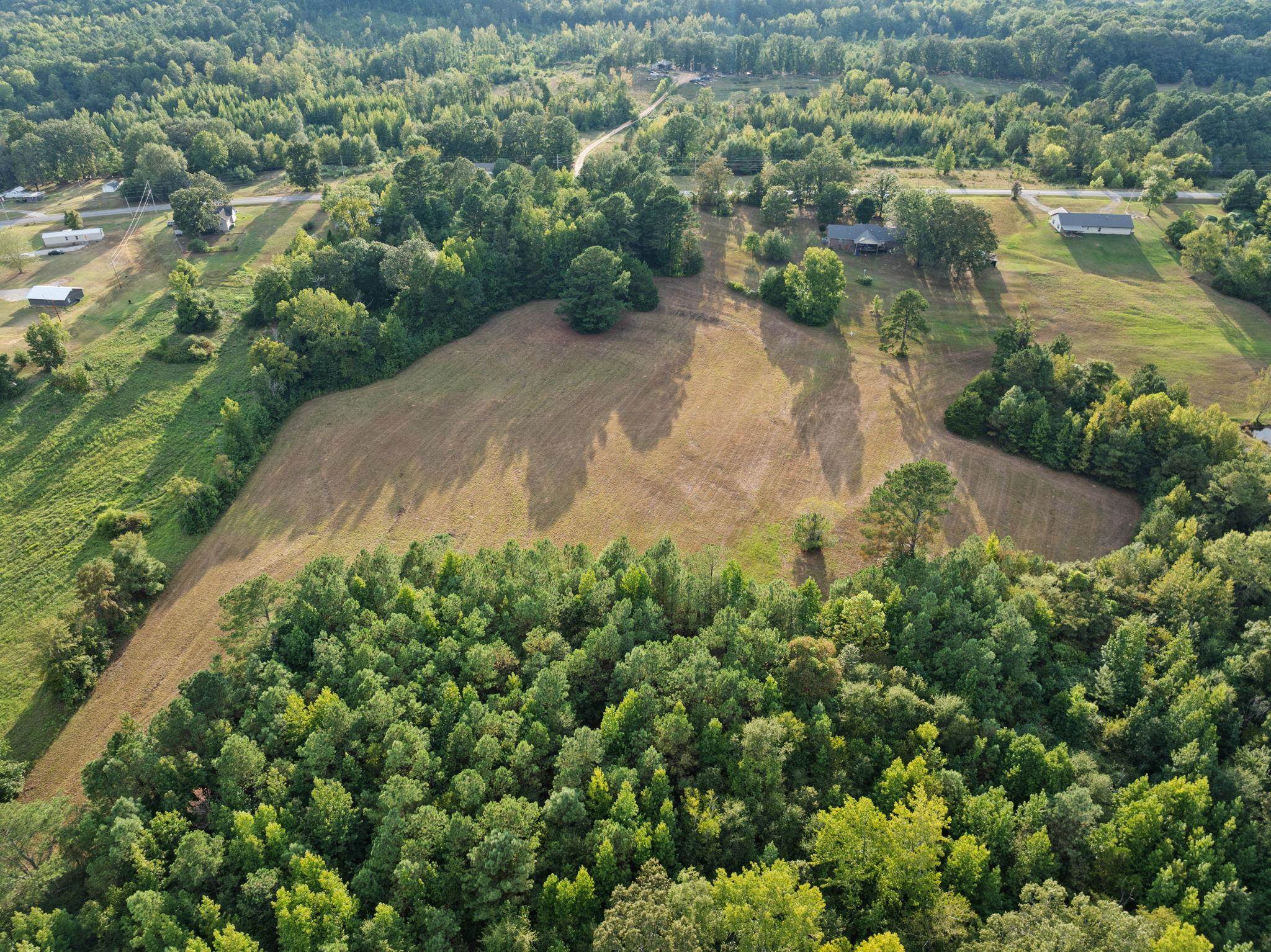 116 County Road 713 Corinth, MS 38834 - Photo 4 of 40 an aerial view of a houses with a lake view
