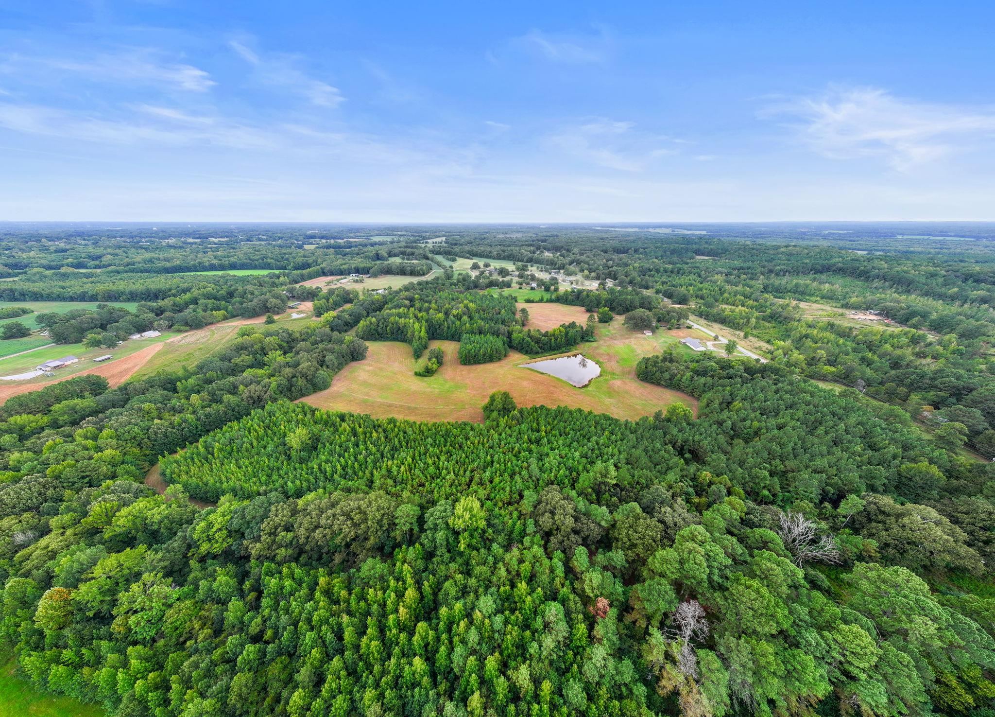 116 County Road 713 Corinth, MS 38834 - Photo 10 of 40 an aerial view of a houses with outdoor space and garden