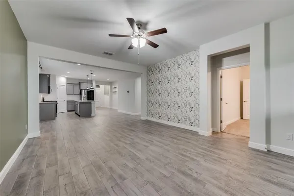 a view of a livingroom with a kitchen