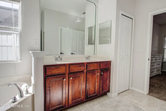 a bathroom with a sink a vanity and a mirror