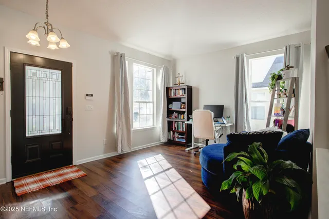 a room with furniture and wooden floor