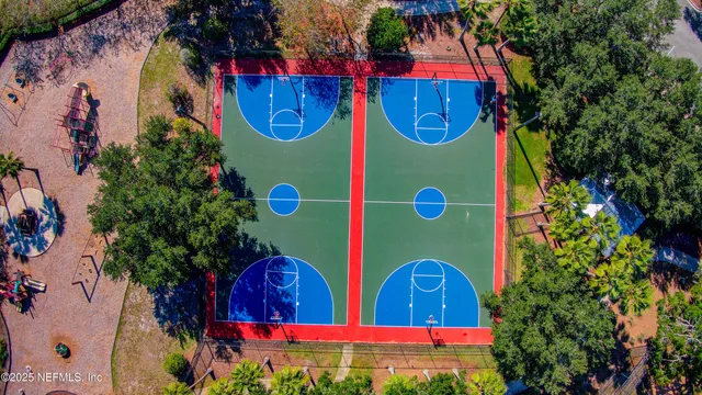 an aerial view of a house with a yard and garden