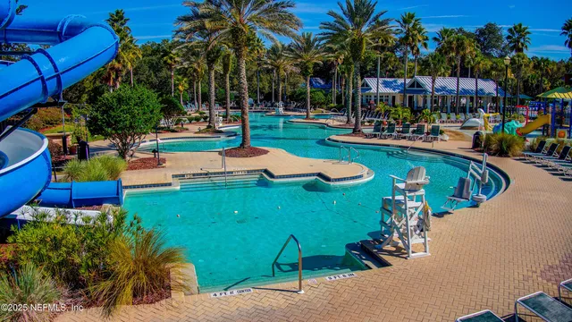 an aerial view of a house swimming pool and outdoor space
