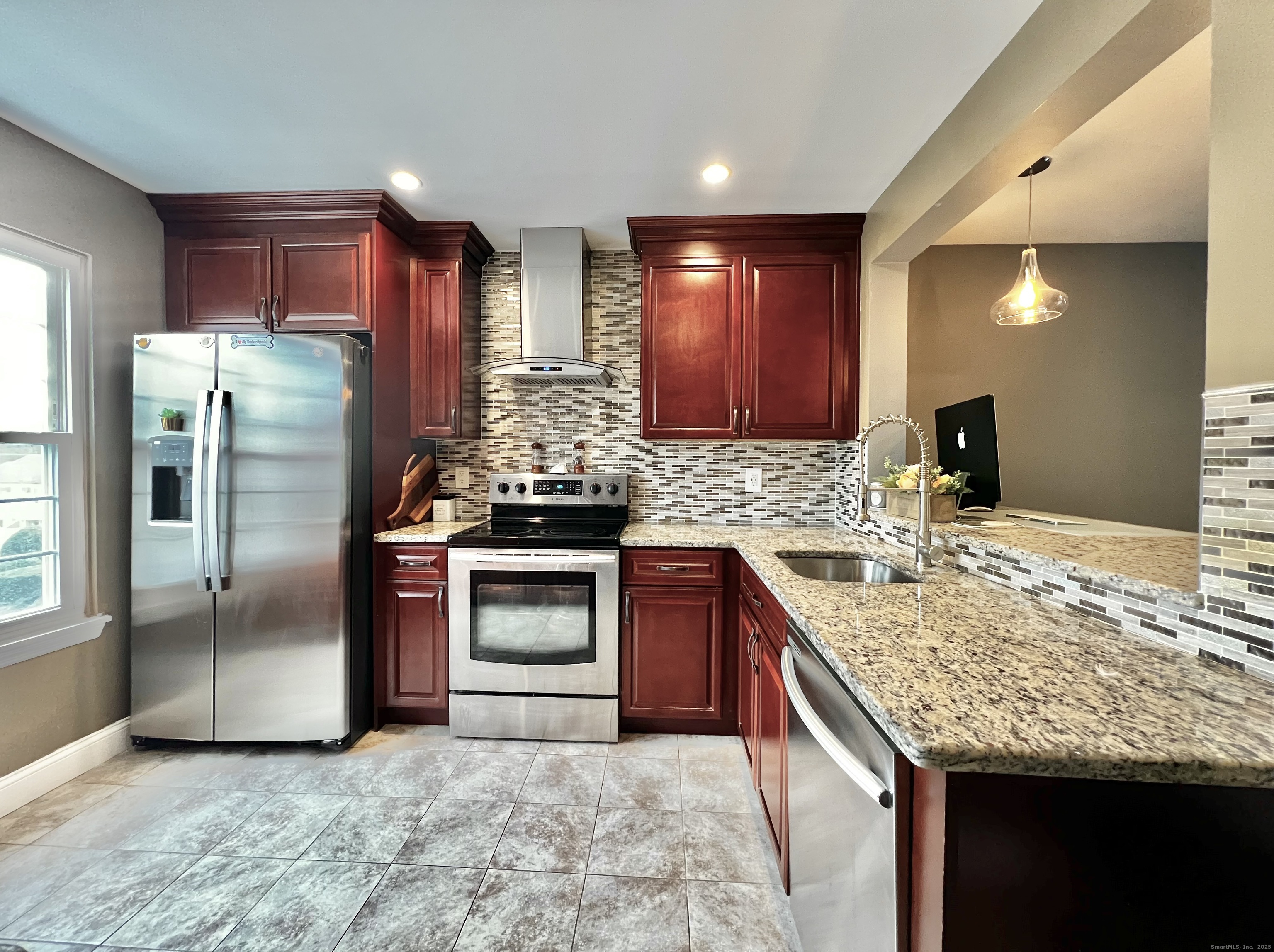 782 Oronoke Road, Unit 27 Waterbury, CT 06708 - Photo 11 of 28 a kitchen with stainless steel appliances granite countertop a refrigerator a stove and a sink