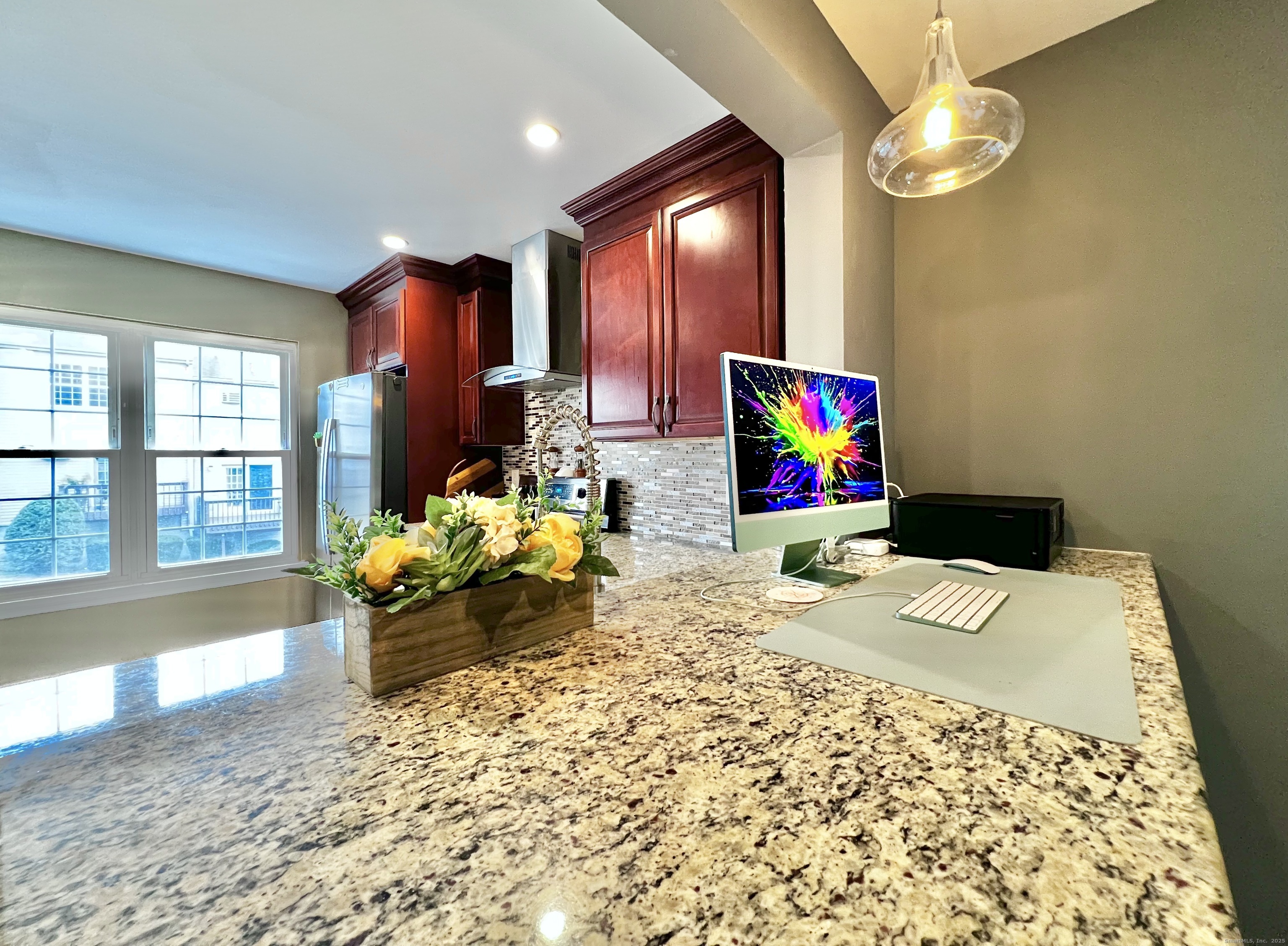 782 Oronoke Road, Unit 27 Waterbury, CT 06708 - Photo 12 of 28 a bedroom with a bed and a chandelier