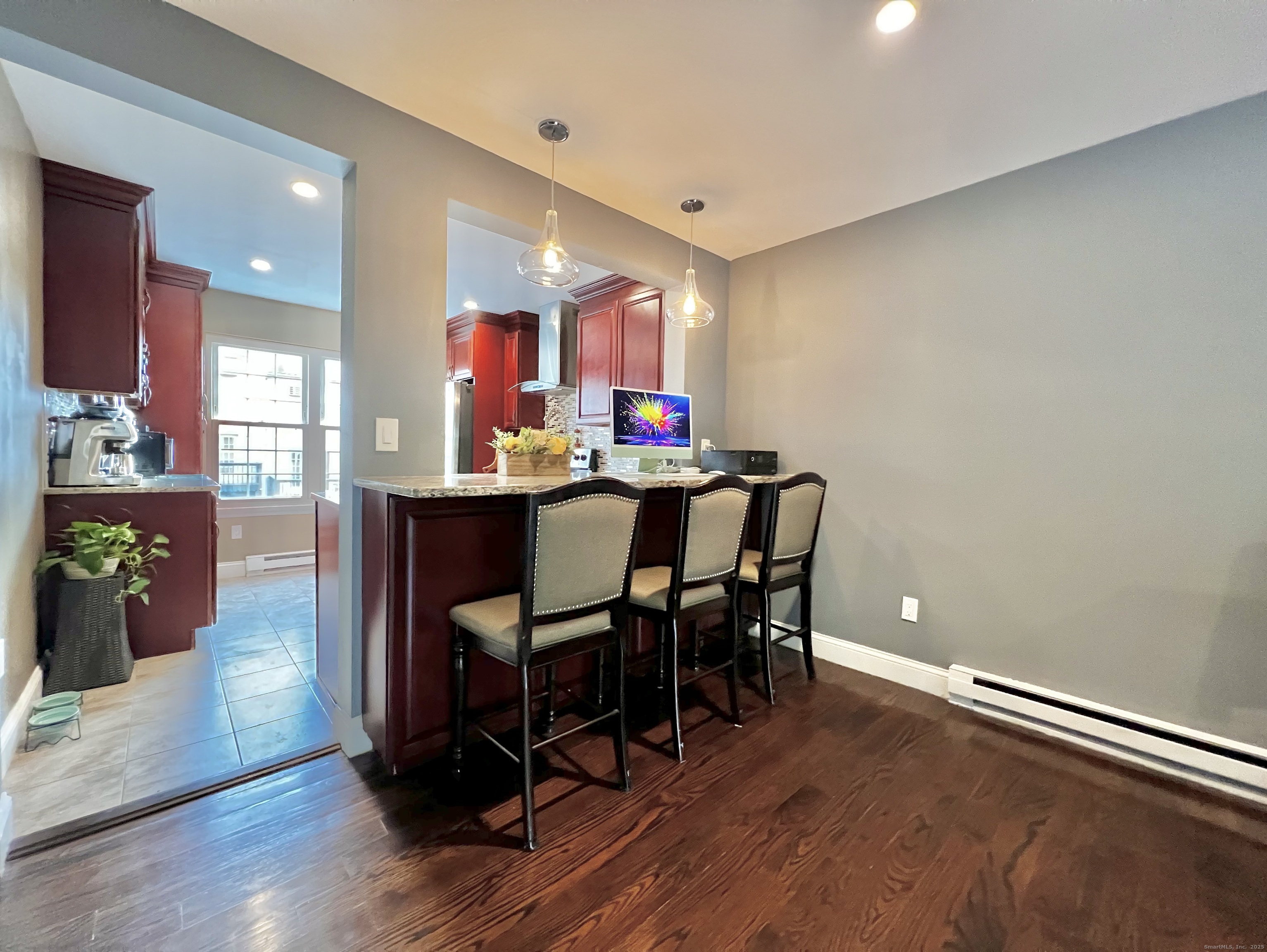 782 Oronoke Road, Unit 27 Waterbury, CT 06708 - Photo 13 of 28 a view of a dining room with furniture and wooden floor