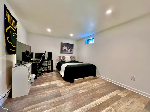 a bedroom with a bed and cabinets
