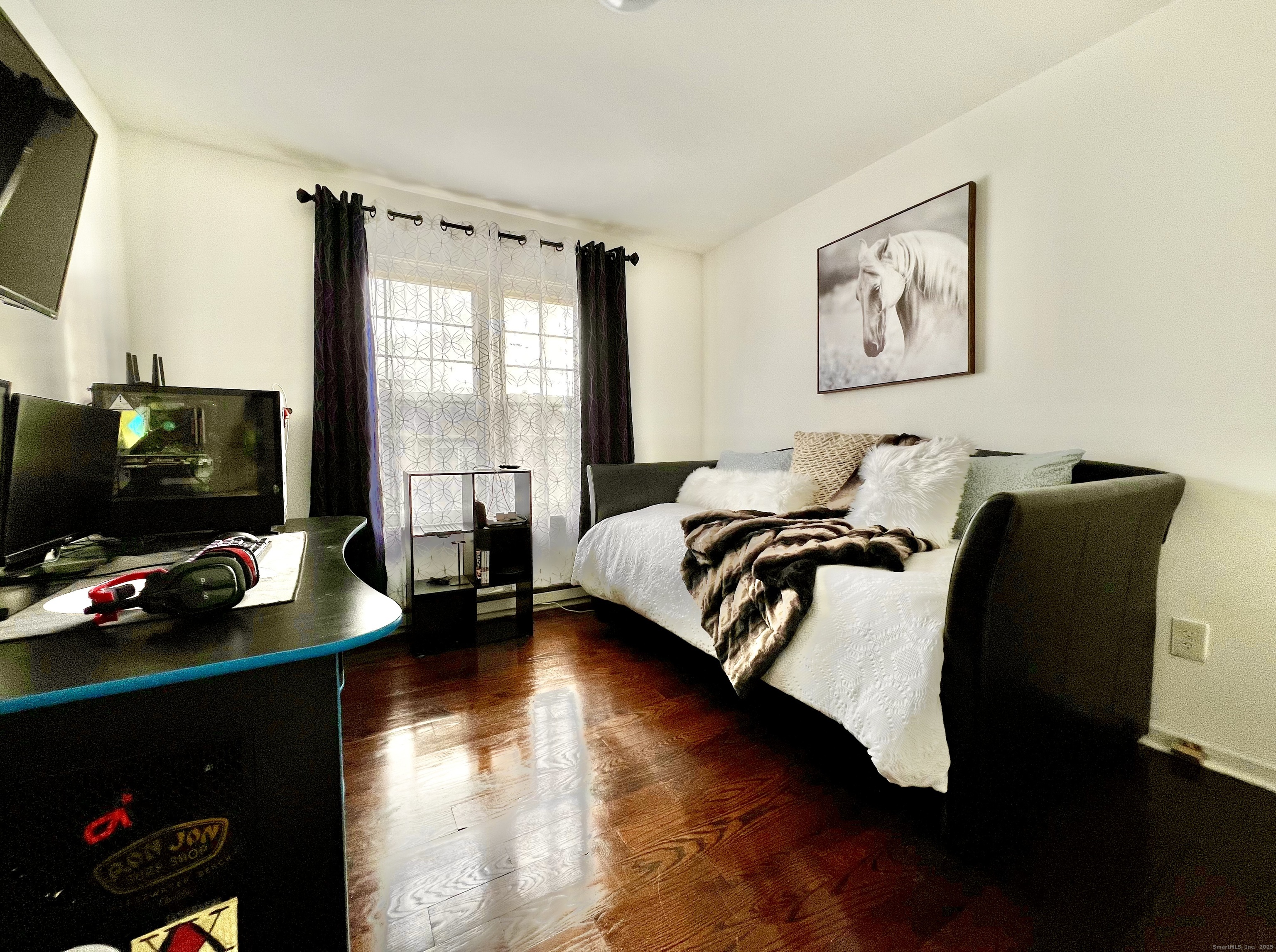 782 Oronoke Road, Unit 27 Waterbury, CT 06708 - Photo 19 of 28 a bedroom with a bed and a flat screen tv